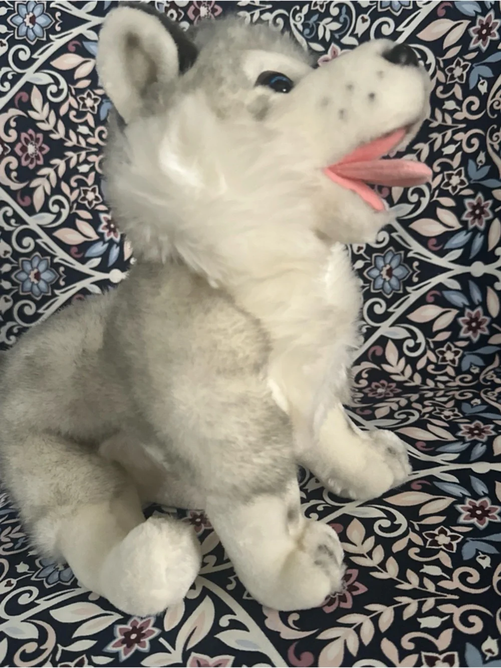 Siberian Husky dog toy with blue eyes and a happy open mouth showing its tongue